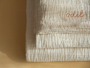 Oatmeal crinkle-cotton personalized towel bundle by atelier an.nur shown from the front in natural light